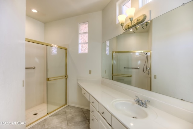 bathroom featuring tile patterned floors, walk in shower, and vanity