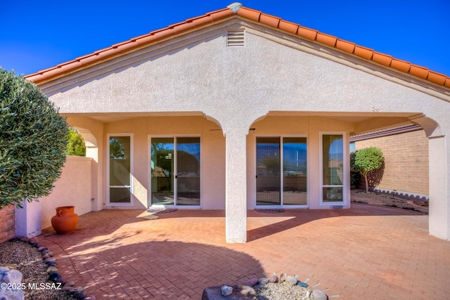 rear view of property with a patio