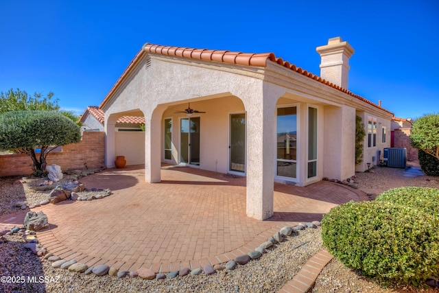 rear view of property featuring a patio area, ceiling fan, and central AC