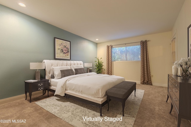 bedroom with recessed lighting, light carpet, and baseboards