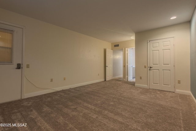 unfurnished room with recessed lighting, carpet, visible vents, and baseboards