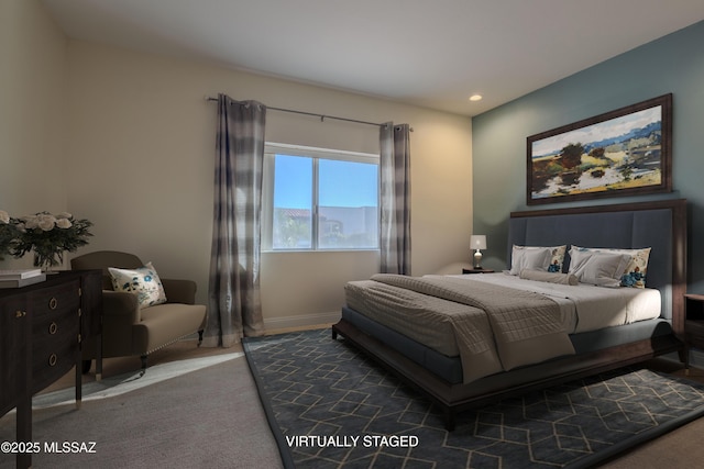 carpeted bedroom featuring baseboards and recessed lighting