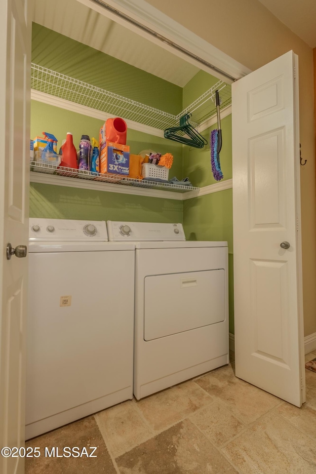 clothes washing area with laundry area and washing machine and clothes dryer