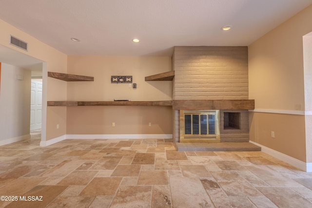 unfurnished living room featuring recessed lighting, a brick fireplace, visible vents, and baseboards