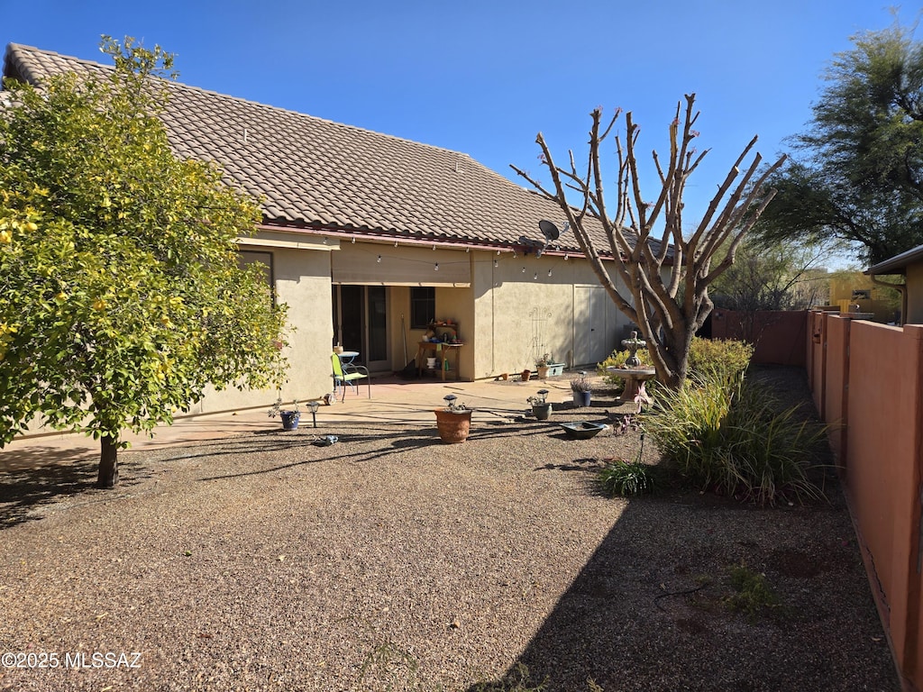 back of property with a patio area