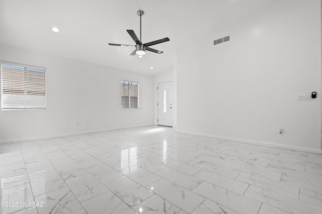 spare room with ceiling fan and lofted ceiling