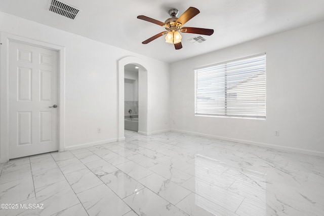 unfurnished room with ceiling fan