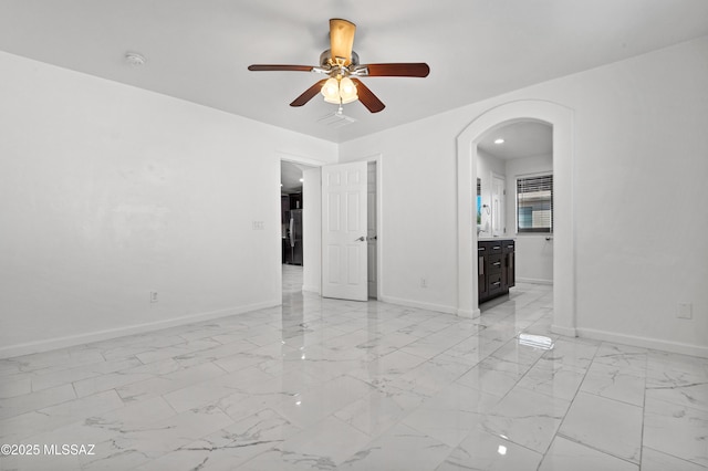 unfurnished room with ceiling fan