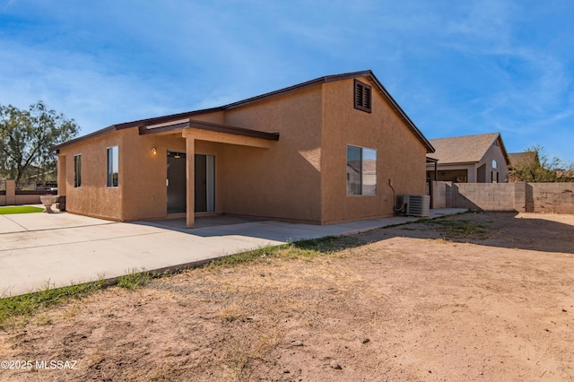 back of property featuring a patio area and central air condition unit