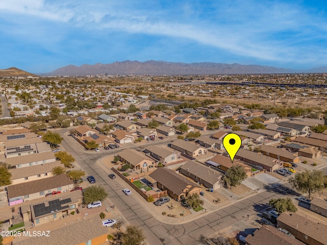 birds eye view of property featuring a mountain view