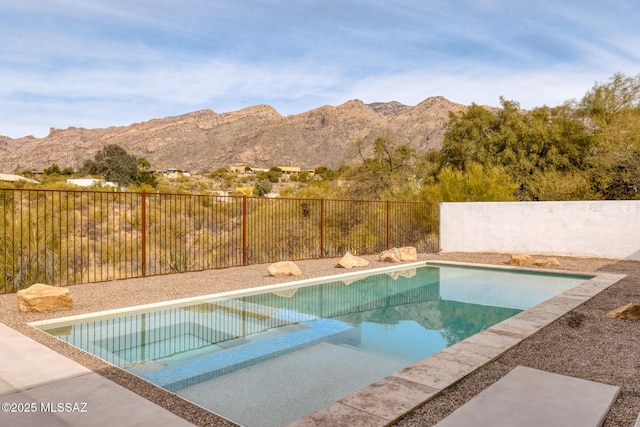 view of swimming pool featuring a mountain view