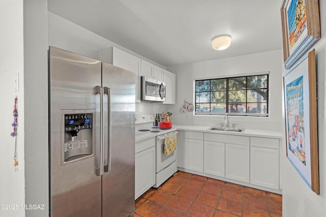 kitchen featuring white cabinetry, stainless steel appliances, and sink