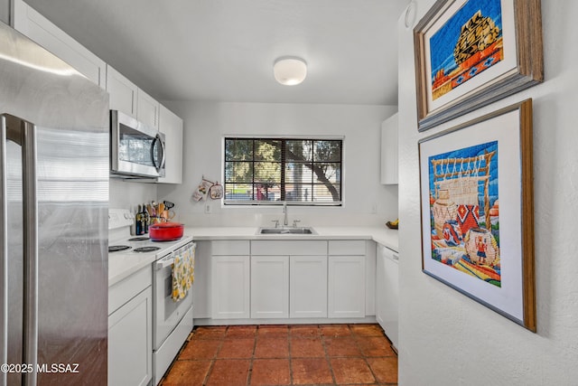 kitchen with white cabinetry, sink, and appliances with stainless steel finishes