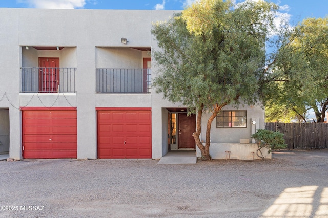 view of front of house with a balcony and a garage