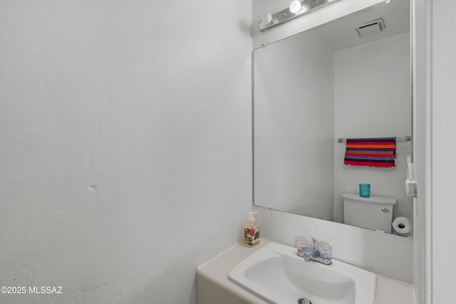 bathroom with sink and toilet