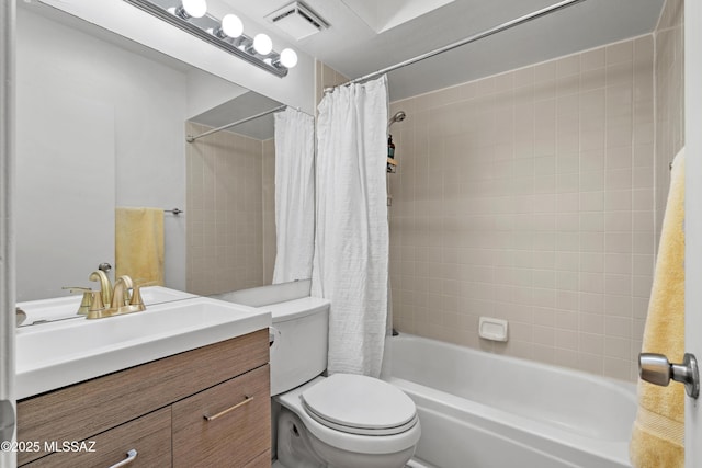 full bathroom featuring vanity, toilet, and shower / tub combo with curtain