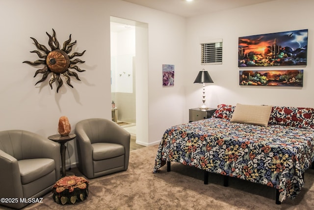 carpeted bedroom featuring connected bathroom