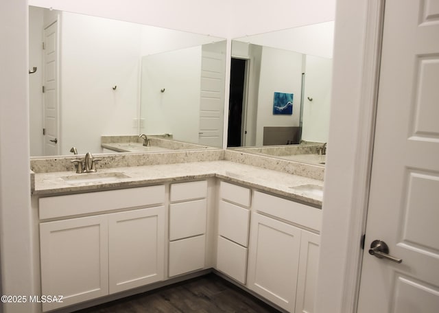 bathroom with hardwood / wood-style floors and vanity