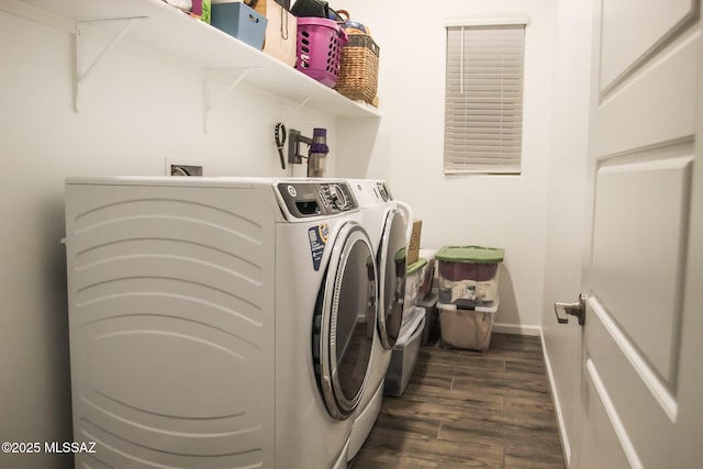 laundry area with dark hardwood / wood-style flooring and independent washer and dryer