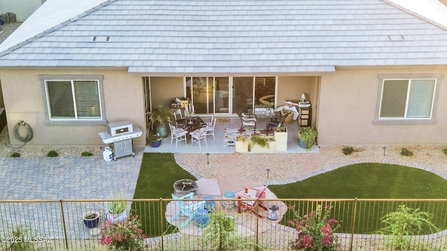 back of property with a patio area