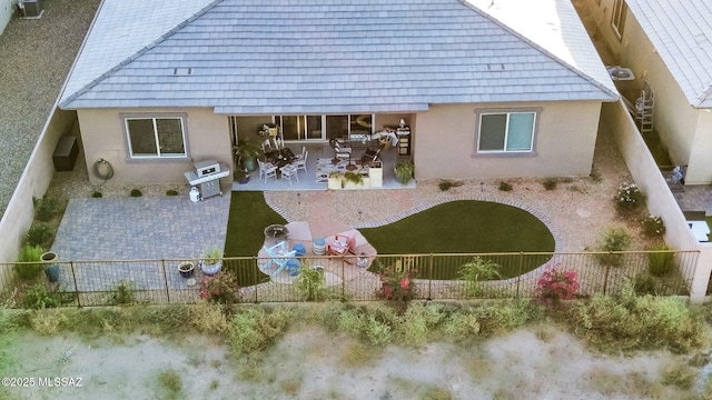 rear view of house with a patio