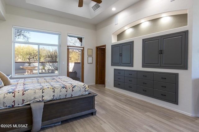 bedroom featuring high vaulted ceiling, access to outside, ceiling fan, and light hardwood / wood-style floors