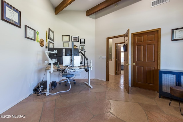 office featuring beamed ceiling