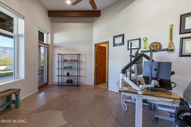 office area with beamed ceiling and ceiling fan