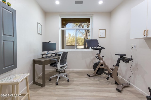 office with light wood-type flooring