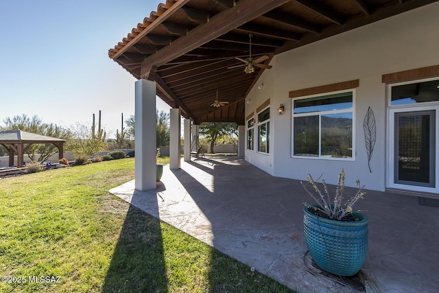 view of patio with a gazebo and ceiling fan