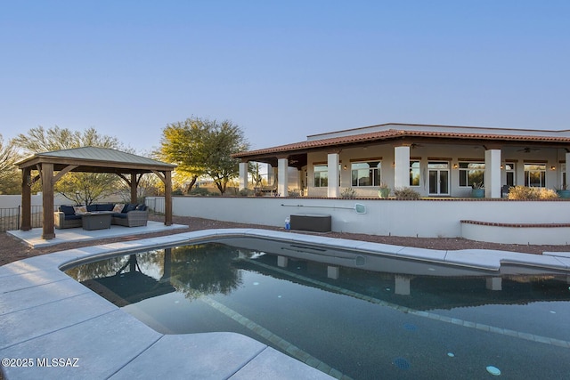 view of pool with a gazebo and outdoor lounge area