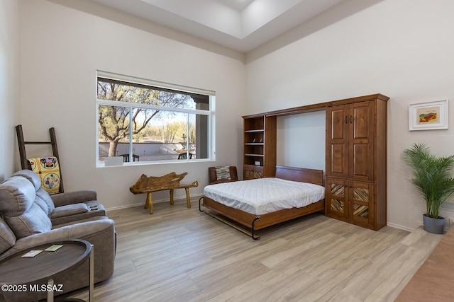 bedroom with light wood-type flooring