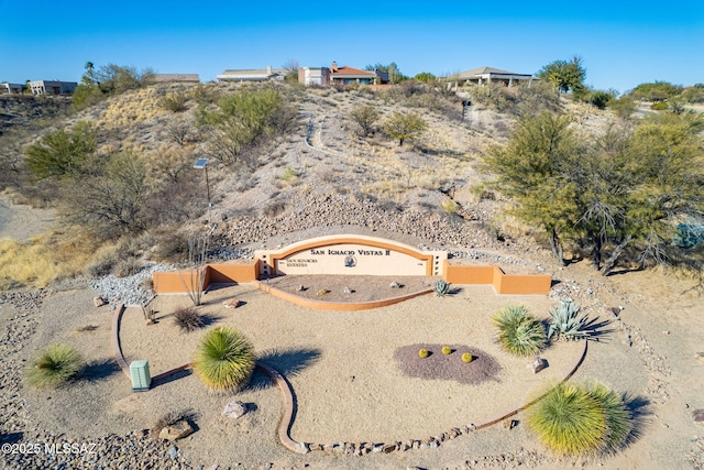 birds eye view of property with view of desert