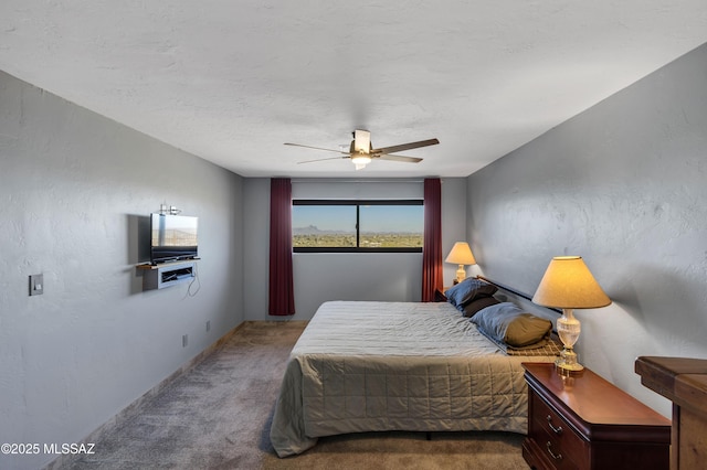 bedroom with ceiling fan and carpet