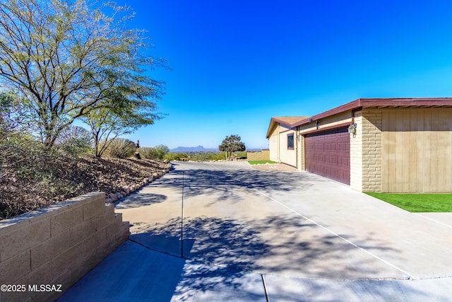 view of property exterior featuring a garage