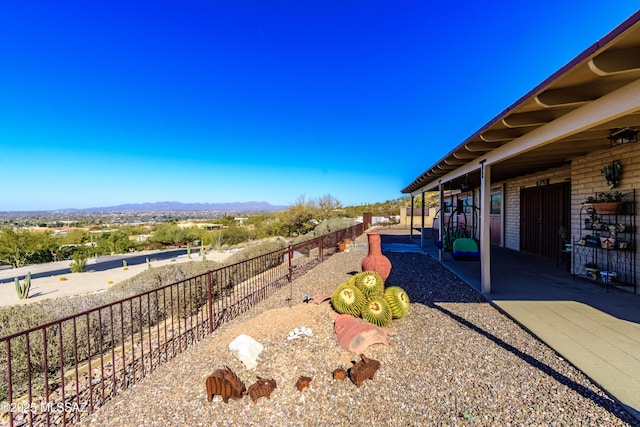 view of yard with a mountain view and a patio area