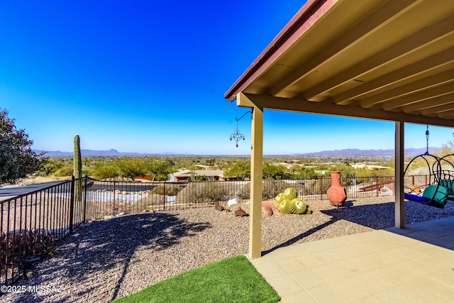 view of yard featuring a mountain view and a patio area