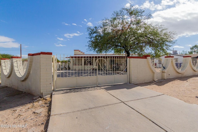 view of gate with fence