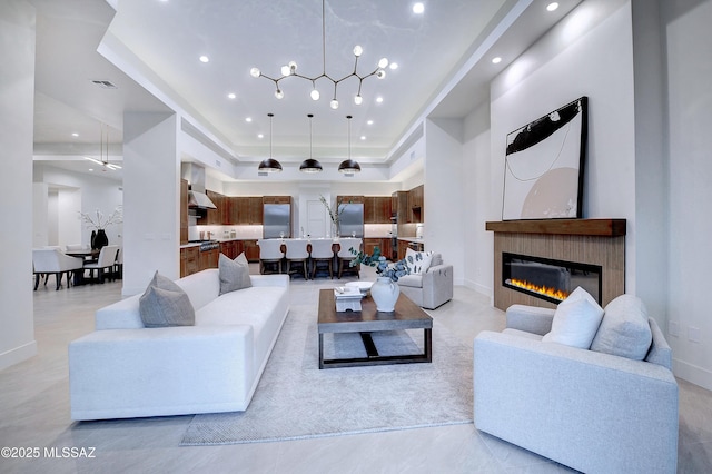 living room featuring a raised ceiling