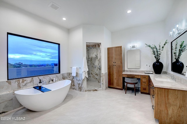 bathroom with vanity, shower with separate bathtub, tile walls, and tile patterned flooring