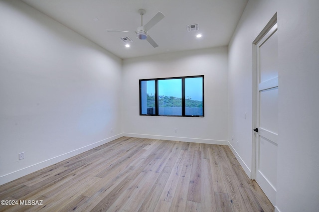 unfurnished room featuring ceiling fan and light wood-type flooring