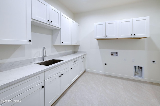 laundry area with washer hookup, sink, electric dryer hookup, hookup for a gas dryer, and cabinets