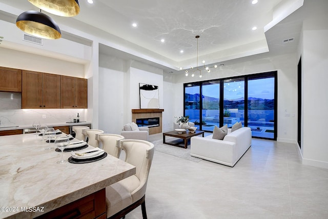 living room featuring a tray ceiling