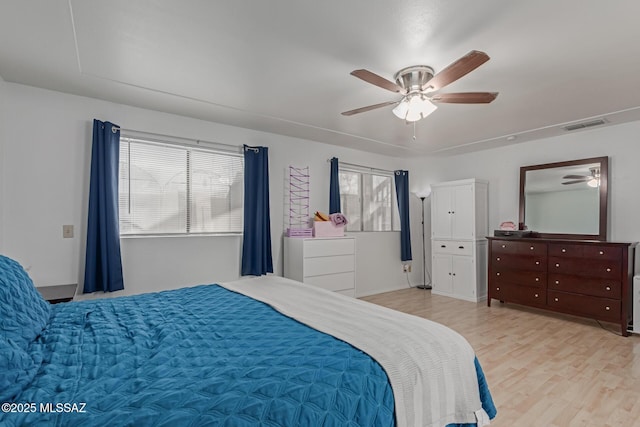 bedroom featuring ceiling fan and light hardwood / wood-style floors