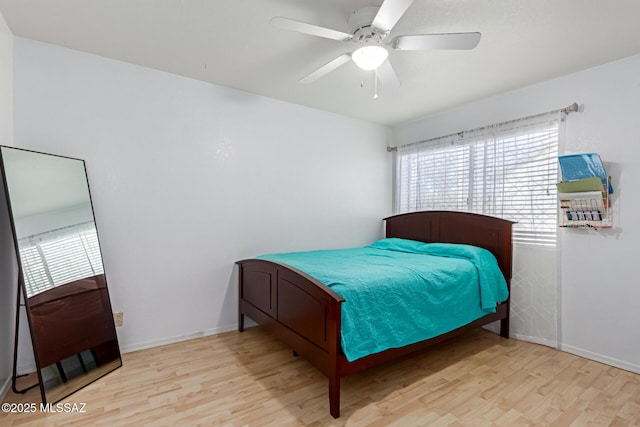 bedroom featuring light wood-type flooring and ceiling fan