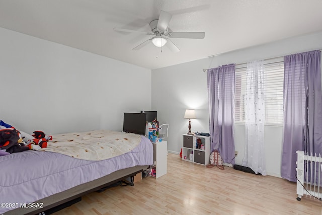 bedroom featuring ceiling fan and light hardwood / wood-style floors