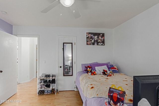 bedroom featuring ceiling fan and hardwood / wood-style flooring