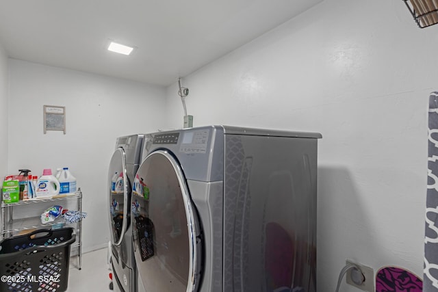 washroom with separate washer and dryer