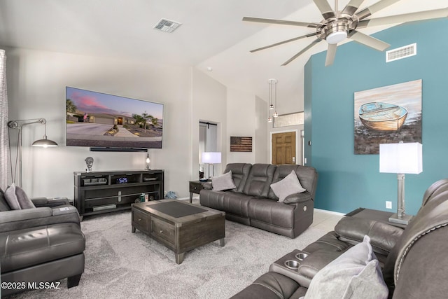 living room featuring vaulted ceiling, light colored carpet, and ceiling fan