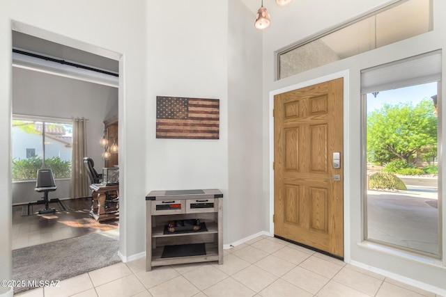 tiled entryway with a healthy amount of sunlight